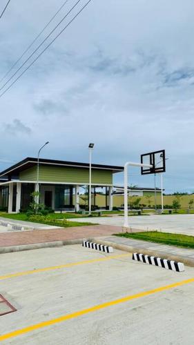 an empty street with a basketball hoop in front of a building at Plumera Condo Near Airport Malls & Schools with Elevator in Lapu Lapu City