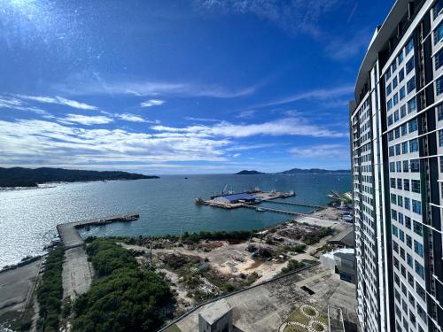 a view of a large body of water from a building at Mango House5-High floor I Biggest unit I Sea view l Mountain view I Waterfilter I Wifi-JQ in Kota Kinabalu