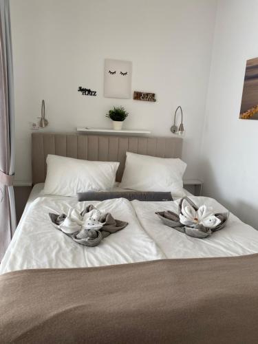 Un ou plusieurs lits dans un hébergement de l'établissement Rosebeach Appartement am Ossiachersee und Gerlitzen Skipiste