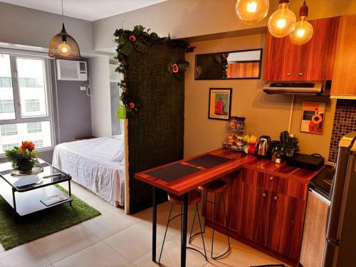 Condo at Avida Towers Riala T2 Bright, Cozy Studio with a Touch of Nature