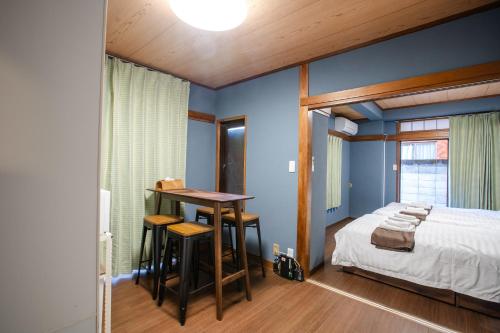 Postel nebo postele na pokoji v ubytování Mitomi inn