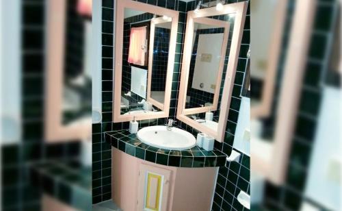 a model of a bathroom with a sink and mirrors at Seaside apartment Baja Sardinia - 6pl June July - 150 m from smeraldo beach in Baja Sardinia