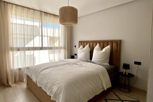 Ένα ή περισσότερα κρεβάτια σε δωμάτιο στο Appartement en résidence Malabata Hills