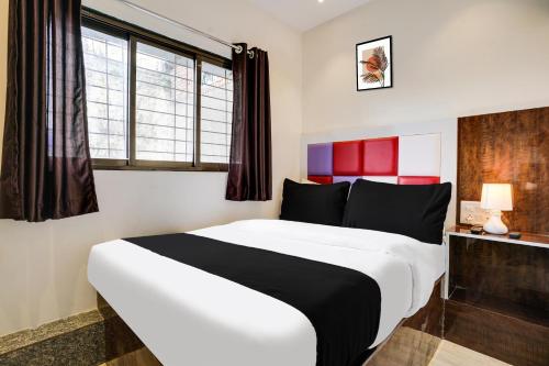 Postel nebo postele na pokoji v ubytování Hotel Orange Residency