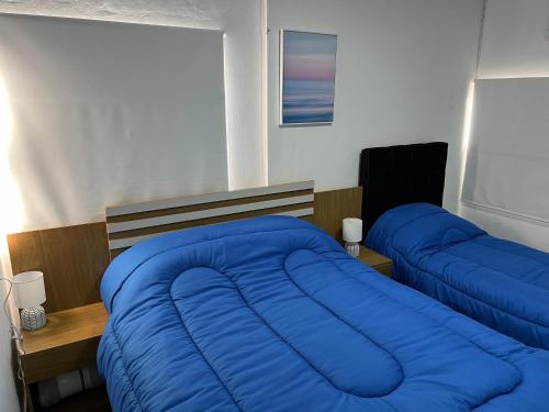 Ένα ή περισσότερα κρεβάτια σε δωμάτιο στο Apart del Este Loft 10