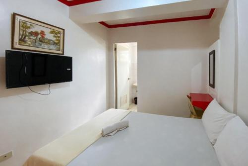 Postel nebo postele na pokoji v ubytování RedDoorz Hostel @ Tita Aidz Inn Baguio