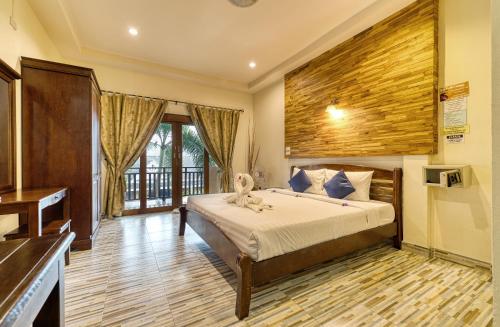 a bedroom with a bed and a piano at The Bulin Residence in Lamai