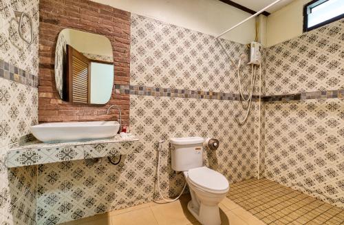 a bathroom with a toilet and a sink at The Bulin Residence in Lamai