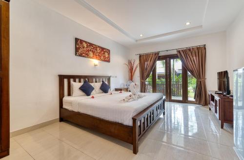 a bedroom with a bed in a room at The Bulin Residence in Lamai
