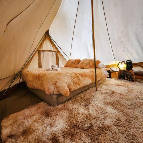 Una cama o camas en una habitación de Glamping Miraflores