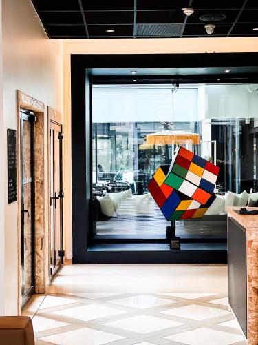 a room with a window with a colorful object in it at Le Néliö in Aix-en-Provence