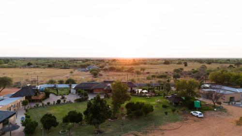 an aerial view of a village with a park at Kebo events agro &self catering apartments in Mochudi