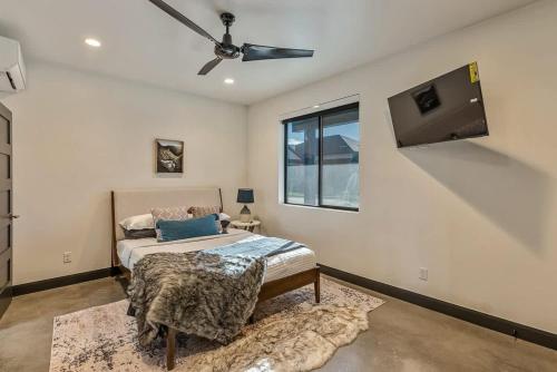a bedroom with a bed and a ceiling fan at Hot Tub Minutes 2 ParkCity & Jodanelle Pets are Allowed in Francis