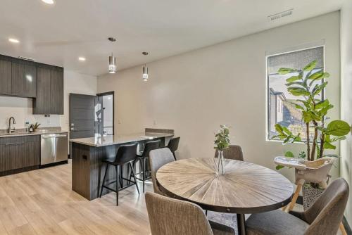 a kitchen and dining room with a table and chairs at Hot Tub Minutes 2 ParkCity & Jodanelle Pets are Allowed in Francis