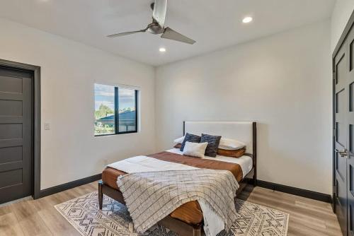 a bedroom with a bed and a ceiling fan at Hot Tub Minutes 2 ParkCity & Jodanelle Pets are Allowed in Francis