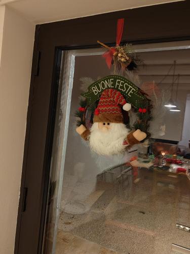 a christmas display window with a santa claus ornament at Trulli di Titti - Luxury Country House in Castellana Grotte