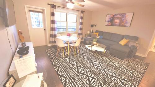 a living room with a couch and a table at Comfy Downtown Condo With Balcony in Atlanta