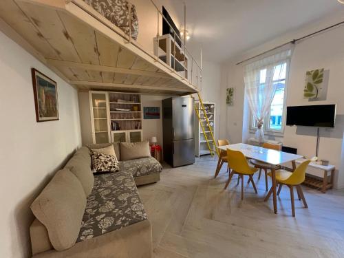 a living room with a couch and a table at Maison Trionfale a 2 passi dal Vaticano in Rome