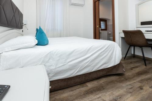 Postel nebo postele na pokoji v ubytování Albergo Cappello e Cadore
