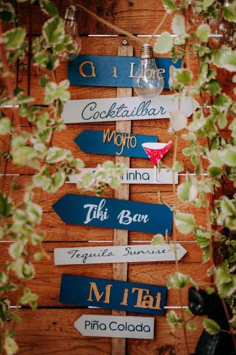 a bunch of signs that are on a wall at Apartament Madlen Art in Olecko