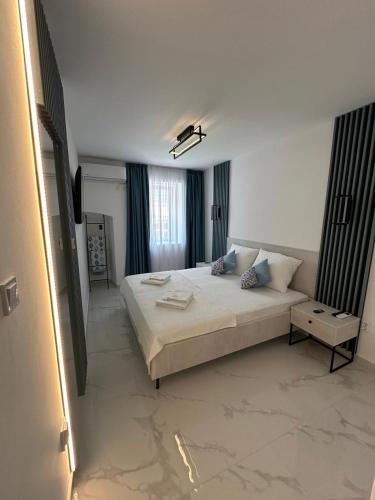 a bedroom with a large bed in a room at Portico Djenovici in Ðenovići