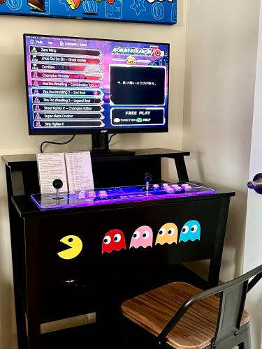 a desk with a computer monitor on top of it at Saugerties Waterfront Getaway in Saugerties