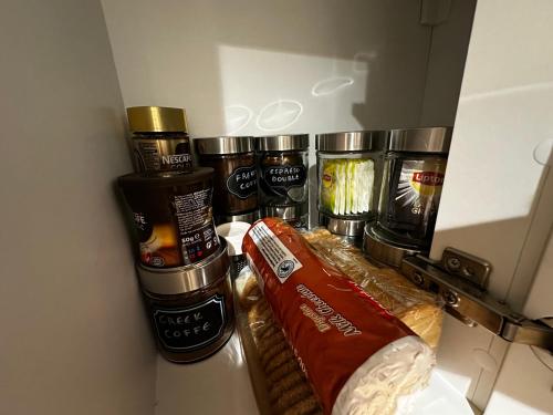 a refrigerator filled with different types of food at Air Suite in Spáta