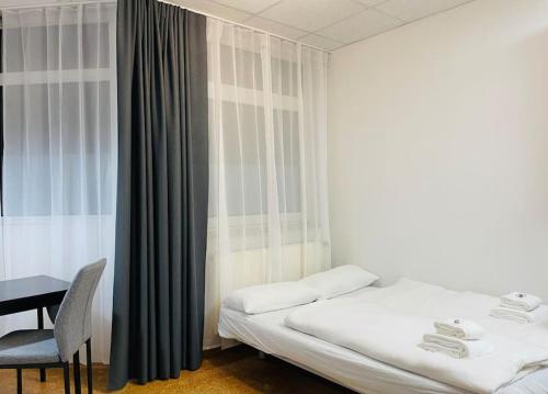 Postel nebo postele na pokoji v ubytování Cozy Studio Apartment