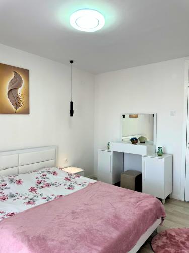 Postel nebo postele na pokoji v ubytování Sant é Apartment