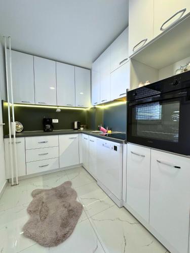 Kuchyň nebo kuchyňský kout v ubytování Sant é Apartment