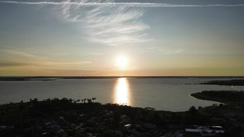 a sunset over a large body of water at Casa Bubba in Federación