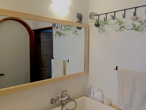 Un baño de 黒崎base