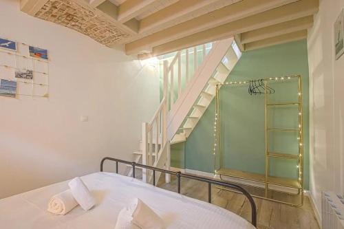 En eller flere senge i et værelse på Les Mouettes