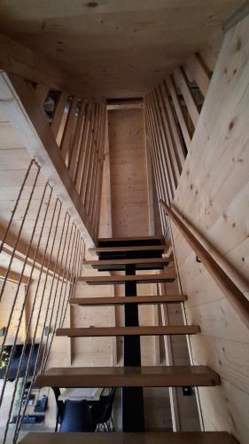 a staircase in a building with wooden walls at Stone Chalets - TERRA in Jajce