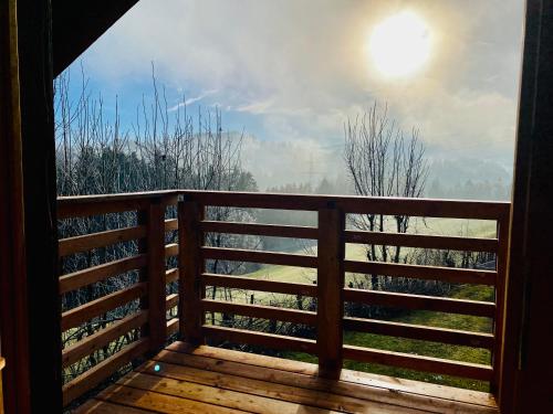 a balcony with a view of the mountains at Birkenhof, Haus Schwänli in Herisau