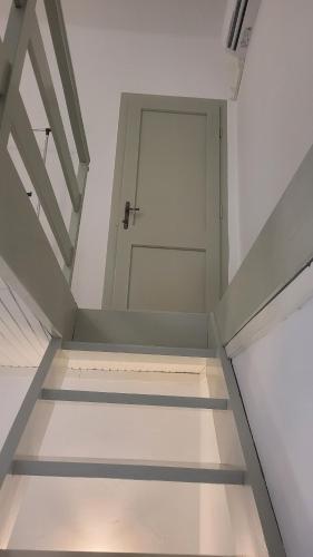 an empty room with a door and a stairway at Duplex apartment in the center of Jelsa, Hvar in Jelsa