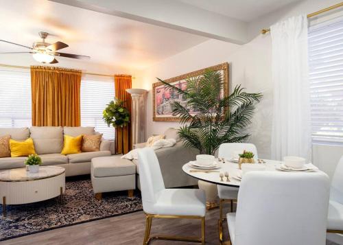 a living room with a couch and a table at Villa Golden - King Bed & Swimming Pool! in Tempe