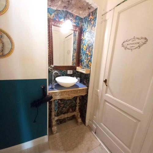 a bathroom with a sink and a mirror at Morosoli Spa in Catania
