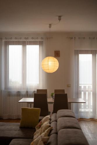 a living room with a couch and a table at Lago di Sole X 6 Point Break in Marone