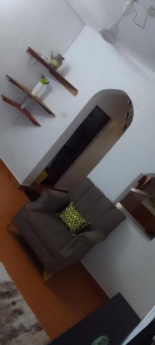 a desk with a couch and a table with a chair at Serena beach villas in Mombasa