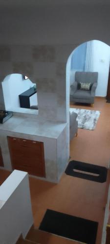 a living room with a couch and a mirror at Serena beach villas in Mombasa