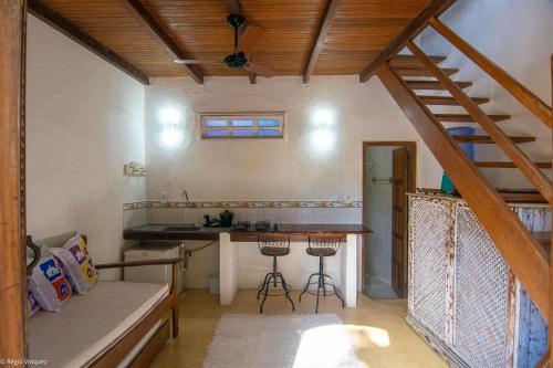 a kitchen with a sink and a counter in a room at Casas da Bete in Trancoso