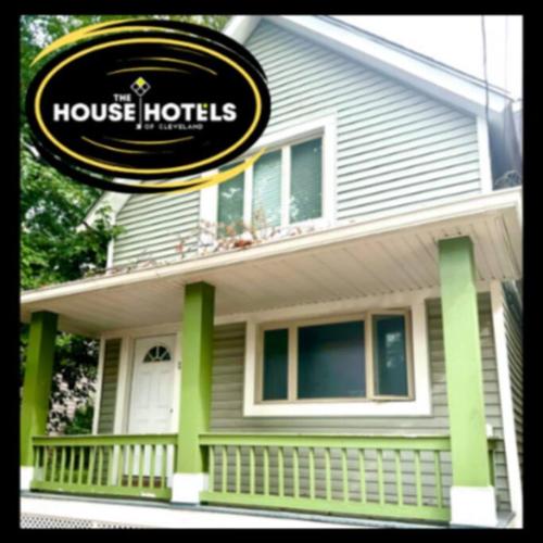 a house with a house hotel sign in front of it at The House Hotels - Terrific W33rd in Cleveland