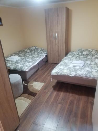 Postel nebo postele na pokoji v ubytování Prenociste Lux