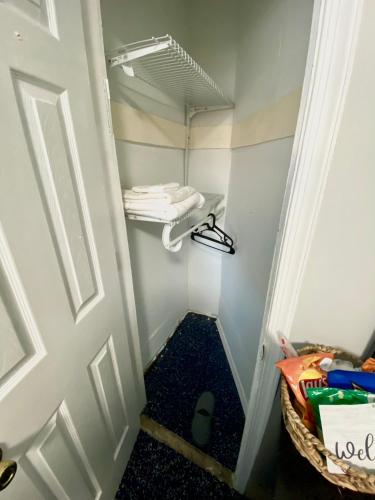 a small walk in closet with a door at Private Room C West NY, NJ 12 mints from NYCit in West New York
