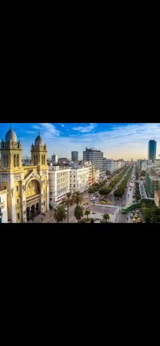 a view of a city with buildings and a street at Deluxe two bedroom apartment with elevator in Ez Zahra