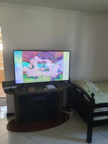 a flat screen tv sitting on a stand in a room at Good choice peace your mind in Sharjah