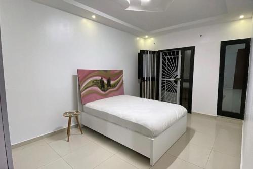 Llit o llits en una habitació de La maison Rose