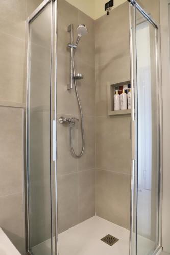 a shower with a glass door in a bathroom at Stelle di Verona - Selene in Verona