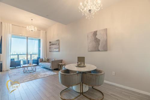a living room with a table and a couch at Lumiére Penthouse in Miami